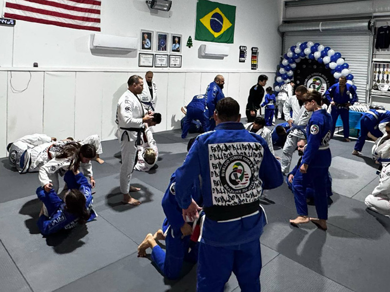 Students training in a BJJ class